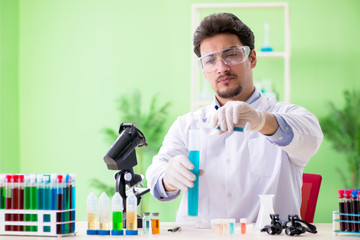 Man chemist working in the lab