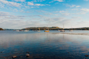 Colourful lake with subtle yachts/boats