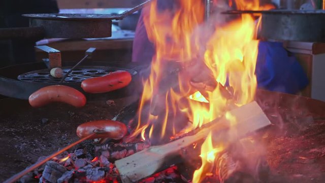 Cooking Sausages or Makara over a Swedish fire Pitt