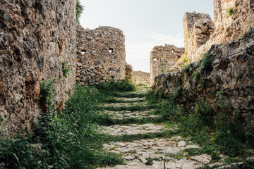 Fototapeta na wymiar Alanya Kalesi. Brick ancient castle wall. Alanya, Turkey. Wonderful country. Ruins of the fortress of Alanya. Brick road