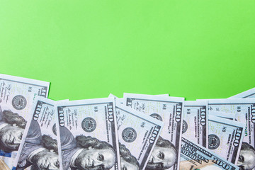 Many bills of 100 dollars, us banknote, green background with money cash currency close-up, the President's face