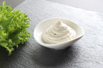 mayonnaise sauce, sour cream on a stone background