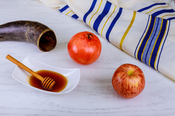 Honey, apple and pomegranate for traditional holiday symbols rosh hashanah jewesh holiday on wooden...