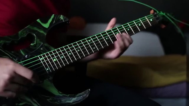playing electric guitar hand of a guitarist