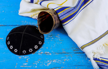 Shofar kippah tallit on white prayer talit. rosh hashanah jewish holiday concept traditional...