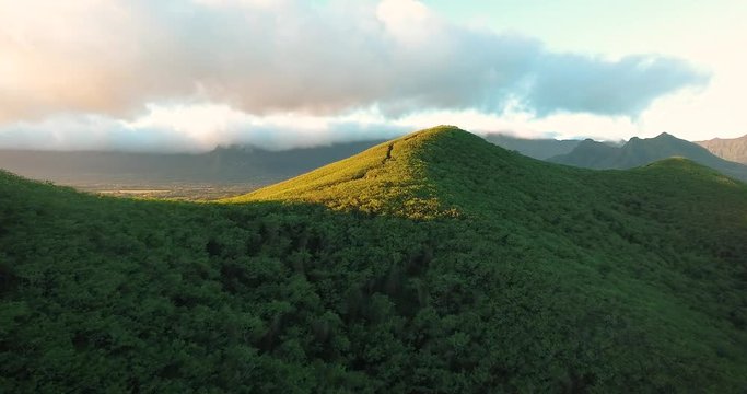 Aerial view over hiking hills in Hawaii at sunrise