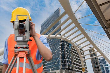 Survey by theodolite concept. Civil Engineer Checking Surveyor Equipment Tacheometer or theodolite...