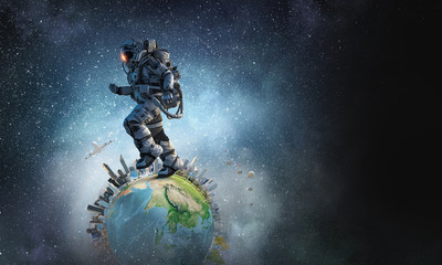 Fototapeta premium Spaceman running fast. Mixed media