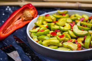 Asian cucumber red bell pepper and chilly hot pepper salad with soy sauce. Authentic Thai food menu. Raw vegan vegetarian healthy food