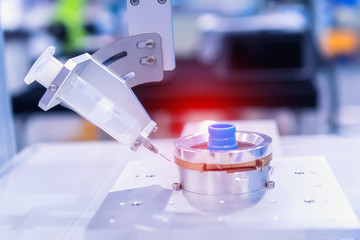 Robot holding glue syringe Injection