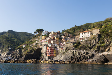 Stunning view from the sea of the Riomaggiore village in the Cinque Terre in Liguria, Italy