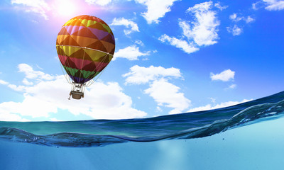 Air balloon over water. Mixed media