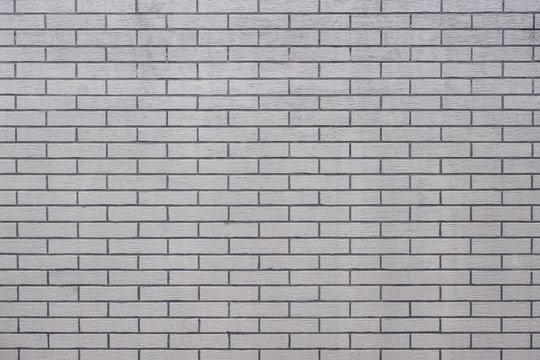 Grunge grey modern brick wall texture background,outdoor wall.