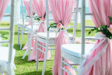 Wedding chair decorated with flowers.