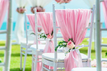 Wedding chair decorated with flowers.
