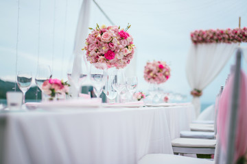 Table setting at a luxury wedding and Beautiful flowers on the table.