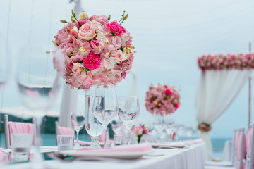 Table setting at a luxury wedding and Beautiful flowers on the table.