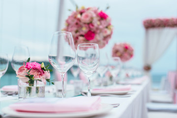 Table setting at a luxury wedding and Beautiful flowers on the table.