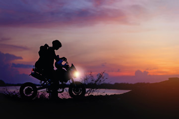 Fototapeta na wymiar man and motorcycle in the sunset