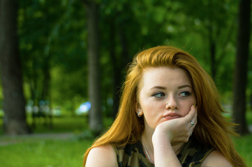 Pretty redhead girl shoot on outdoor park