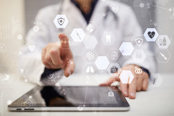 Medicine doctor is using modern computer virtual screen interface, medical concept. EHP, EMR,...