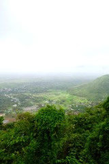 Fototapeta premium Green landscape surrounded by hills, mountains in monsoon season 