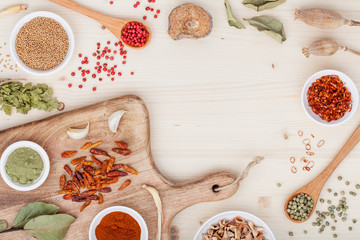 spices and herbs on kitchen wooden table background with copy space for text. food, cooking and...