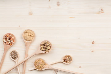 spices and herbs on kitchen wooden table background with copy space for text. food, cooking and restaurant concept. flat lay composition, top view