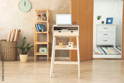 High Wooden Table With Laptop As Stand Up Workplace In Modern