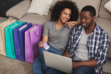 Young black couple shopping online