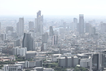 Modern buildings in the metropolis with a pollution haze in the air
