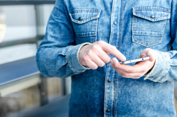 Close Up Hipster Business Man Using Smart Mobile Phone App Outdoor Black Oled Display Background Denim Jeans shirt Stylish Dressed