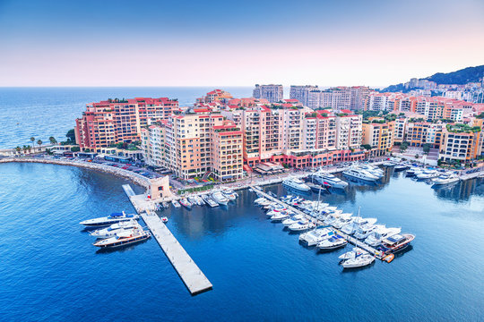 Monaco, Europe. Panoramic scenic view on fashionable apartment district and port Fontvieille in Monaco - small country, symbol of wealth and richness. Beautiful evening skyline of Monaco. 