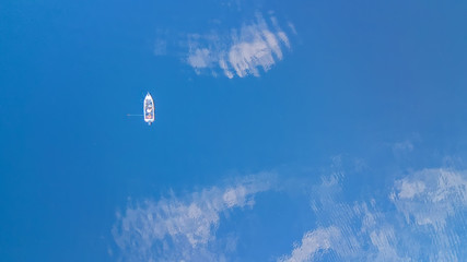 Boat cruising blue Mediterranean sea aerial view