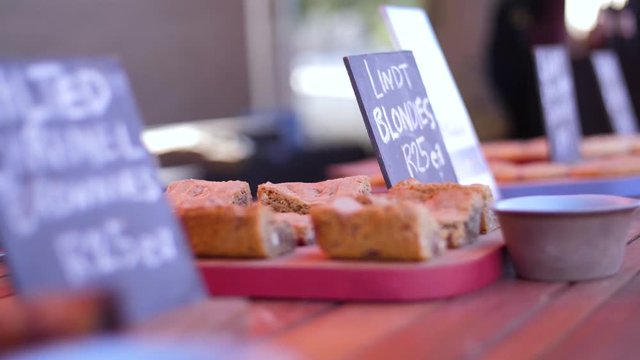 Baked desserts food stall table with chalkboard signs