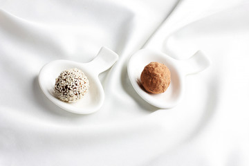 Homemade healthy raw candy truffle with sesame and chocolate