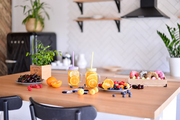 Healthy breakfast. A lot of berries. Apricot berry and donuts. A lot of food. European breakfast.  