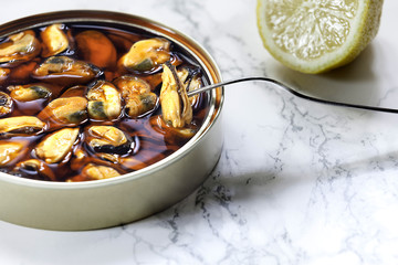 tin pickled mussels on marble