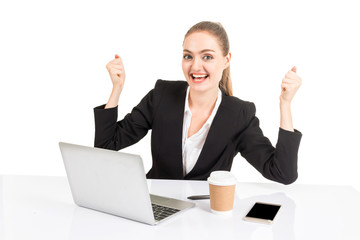 Successful businesswoman celebrating with arms up working project planning on the laptop computer isolated on white background