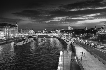 Urban night background, Moscow, the capital of Russia. Embankment in the city center, view of the river and the historic center of the city