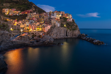 Fototapeta na wymiar Manarola at night, one of colorful villages of Cinque Terre, Italy