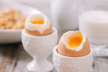 delicious breakfast with boiled eggs and crispy toasts, horizontal, closeup