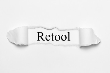 Retool on white torn paper