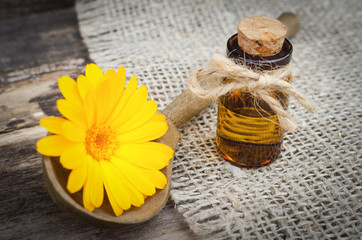 Calendula flower essential oil. Naturopathy. Herbal medicine.