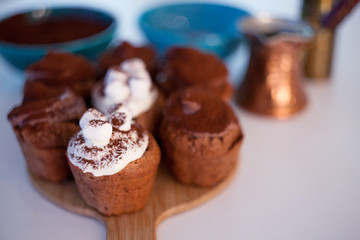 tasty birthday cupcake with candle on the table, blurred background