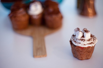 tasty birthday cupcake with candle on the table, blurred background