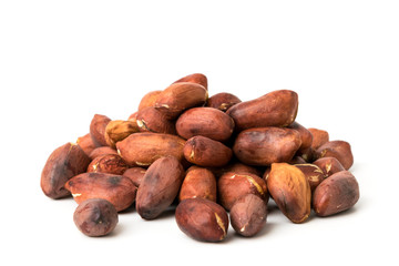 A bunch of roasted peanuts on a white, closeup.