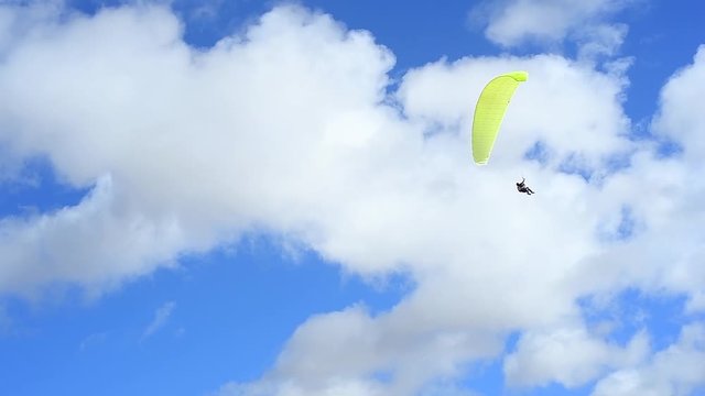 a flying paraglider close