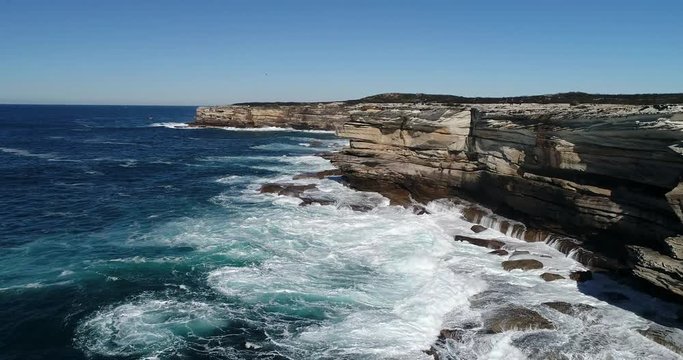 Low to water level along high sandstone rocks around Cape Solander in national park of Sydney&rsquo;s pacific coast.
