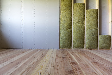 Wooden frame for future walls with drywall plates insulated with rock wool and fiberglass...